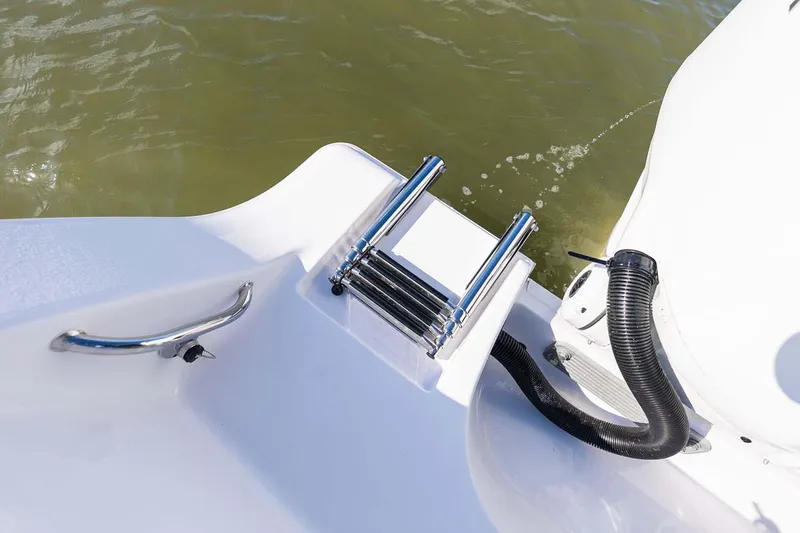 Slide: The Image of Manufacturer Provided Image: 2024 Sportsman Open 282TE Center Console boat ladder and handle detail. - 35
