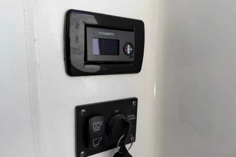 Slide: The Image of Control panel on 2024 Sportsman Open 282TE Center Console boat. - 36