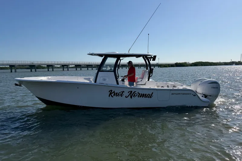 Slide: The Image of 2024 Sportsman Open 282TE Center Console boat on water, side view. - 9