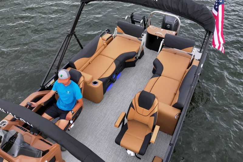 Slide: The Image of 2026 Avalon LSZ Quad Lounger Shift pontoon boat on water, featuring luxurious seating and modern design. - 8