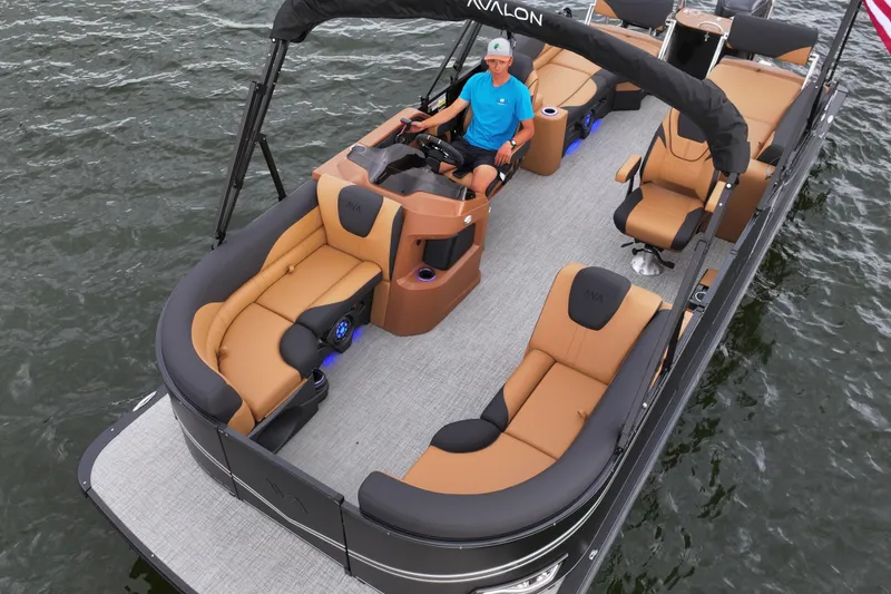 Slide: The Image of 2026 Avalon LSZ Quad Lounger Shift pontoon boat on water, featuring luxurious seating. - 9