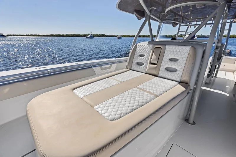 Slide: The Image of 2022 Contender 44 CB boat with luxurious seating on a sunny day. - 16