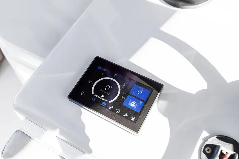 Slide: The Image of Control panel on 2022 Contender 44 CB boat, displaying Seakeeper stabilization system. - 25