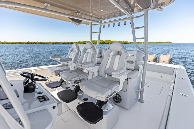 Slide: The Image of 2022 Contender 44 CB boat interior with luxury seating and ocean view. - 27