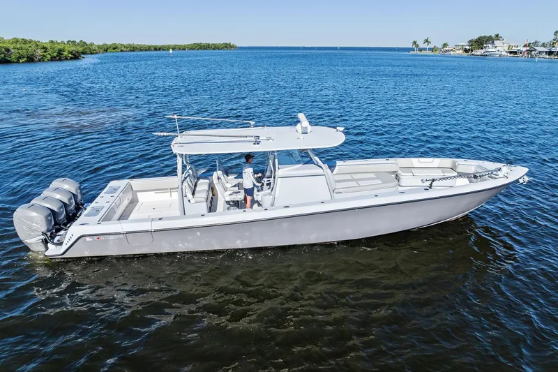 Slide: The Image of 2022 Contender 44 CB boat cruising on a calm blue sea. - 3