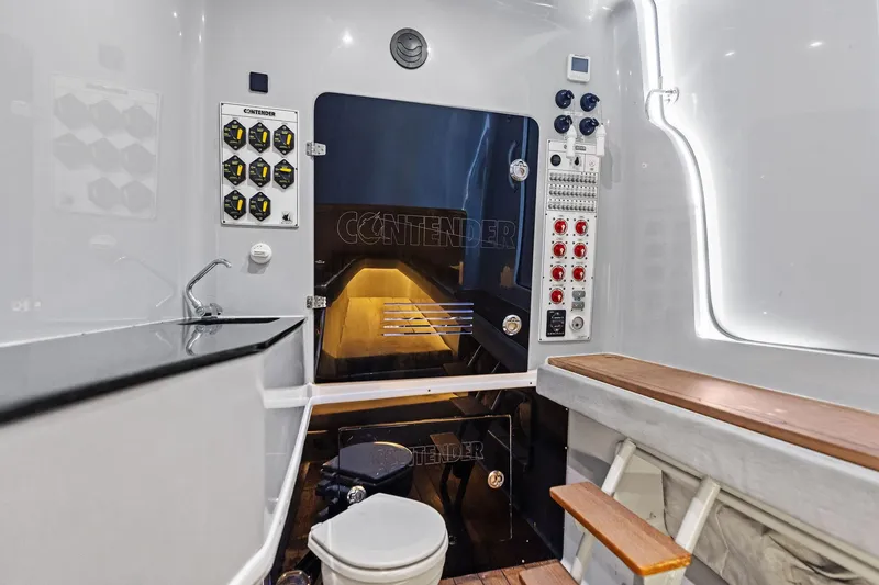 Slide: The Image of 2022 Contender 44 CB boat interior with control panels, seating, and modern amenities. - 34