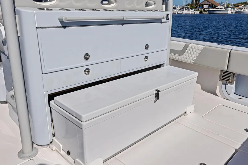 Slide: The Image of 2022 Contender 44 CB boat storage compartments with ocean view in the background. - 38