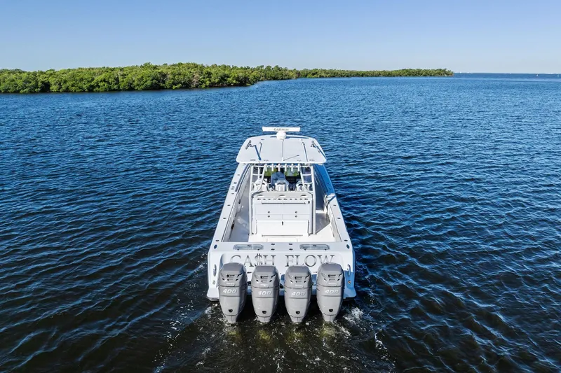 Slide: The Image of 2022 Contender 44 CB boat with four engines cruising on open water. - 4