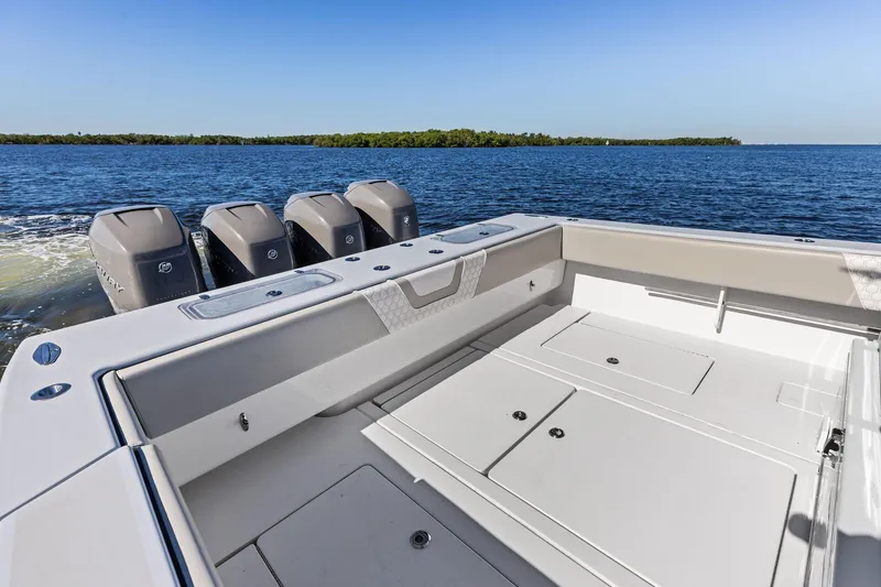 Slide: The Image of 2022 Contender 44 CB boat with four engines on open water. - 41