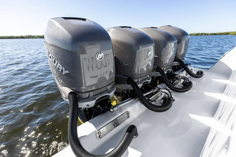 Slide: The Image of Four powerful Mercury outboard engines on a 2022 Contender 44 CB boat. - 43