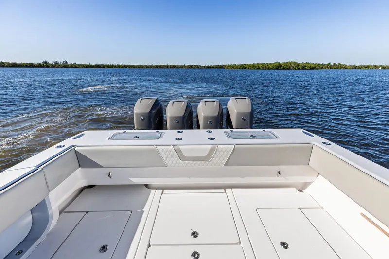 Slide: The Image of Contender 44 CB 2022 boat with four engines on open water. - 45