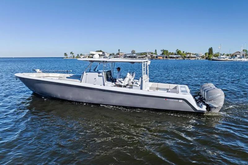 Slide: The Image of 2022 Contender 44 CB boat cruising on a sunny day with clear blue skies. - 5