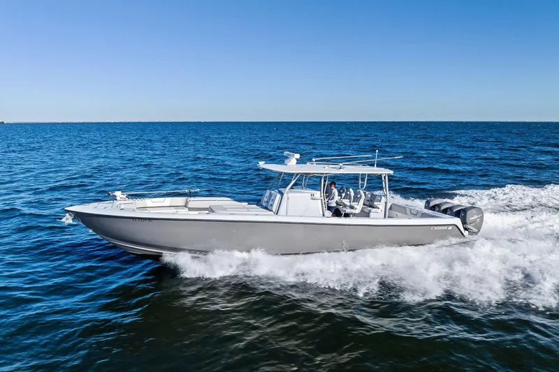 Slide: The Image of 2022 Contender 44 CB boat cruising on open ocean waters. - 50