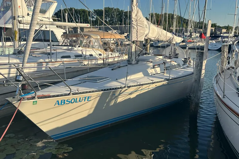 The Image of 1984 C&C 41 sailboat named "Absolute" docked at a marina. - 0