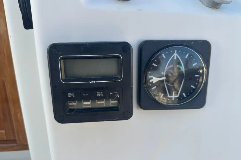 Slide: The Image of Digital and analog gauges on a 1984 C&C 41 sailboat dashboard. - 13