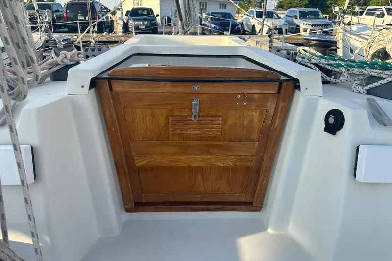 Slide: The Image of Cockpit of 1984 C&C 41 sailboat with wooden hatch and rigging ropes. - 15