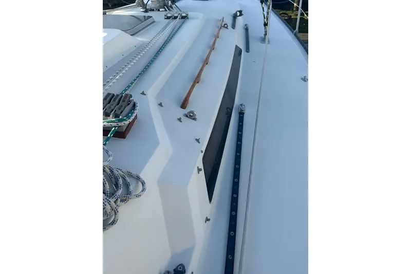 Slide: The Image of 1984 C&C 41 sailboat deck with ropes and fittings. - 17