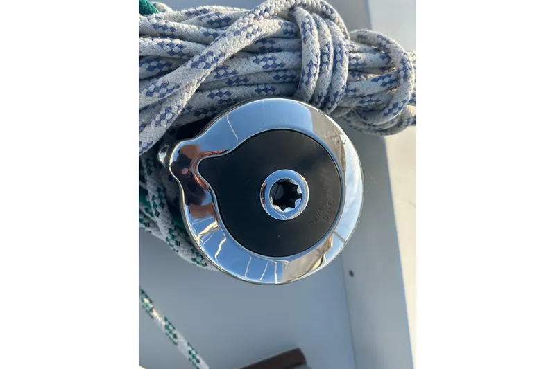 Slide: The Image of Close-up of a winch on a 1984 C&C 41 sailboat with coiled ropes. - 19