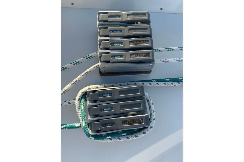 Slide: The Image of Sailing rope clutches on a 1984 C&C 41 yacht deck, featuring labeled levers. - 20