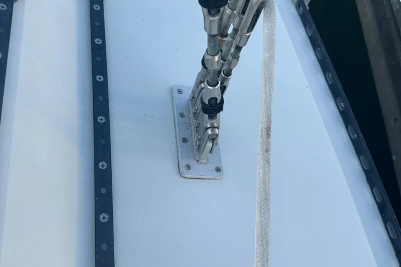 Slide: The Image of Deck hardware on a 1984 C&C 41 sailboat, featuring rigging and fittings. - 22