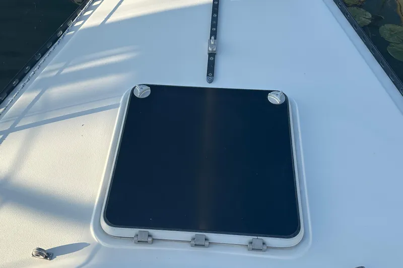 Slide: The Image of Deck hatch of a 1984 C&C 41 sailboat, featuring a sleek design. - 25