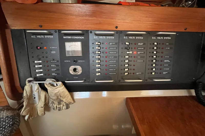 Slide: The Image of Electrical control panel on a 1984 C&C 41 sailboat, featuring AC and DC systems. - 48