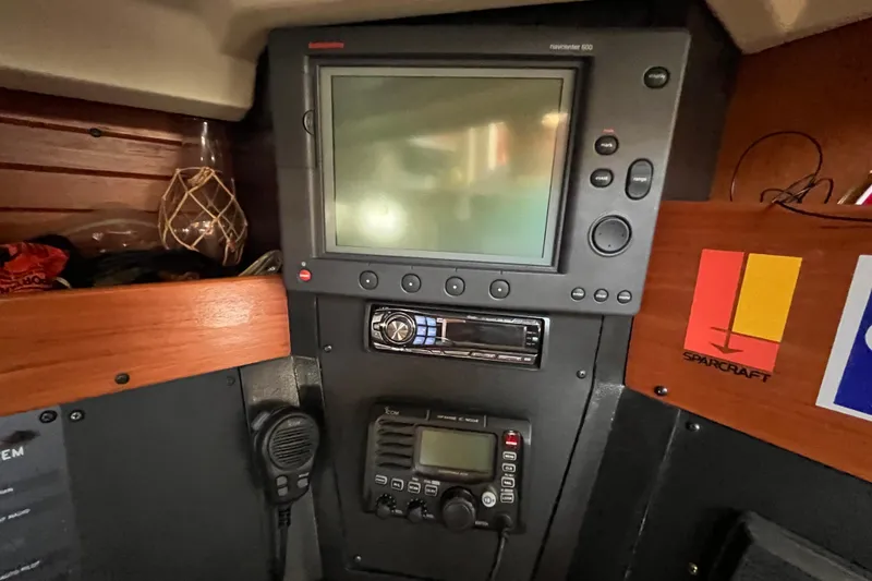 Slide: The Image of Navigation equipment inside a 1984 C&C 41 sailboat cabin. - 49