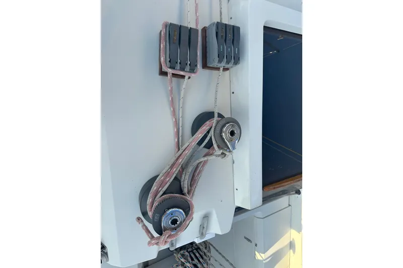 Slide: The Image of Sailing rigging on a 1984 C&C 41 yacht, featuring ropes and pulleys. - 6