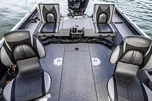 Slide: The Image of 2026 Lund 1875 Impact XS SS boat interior with open storage compartments. - 11