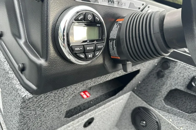 Slide: The Image of 2026 Lund 1875 Impact XS SS dashboard with audio controls and steering wheel detail. - 18