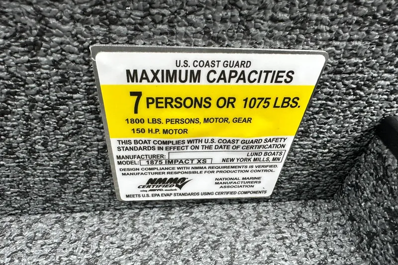 Slide: The Image of 2026 Lund 1875 Impact XS SS capacity label, 7 persons or 1075 lbs, 150 HP motor. - 22