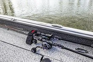 Slide: The Image of 2026 Lund 1875 Impact XS SS boat interior with seating and steering console. - 7