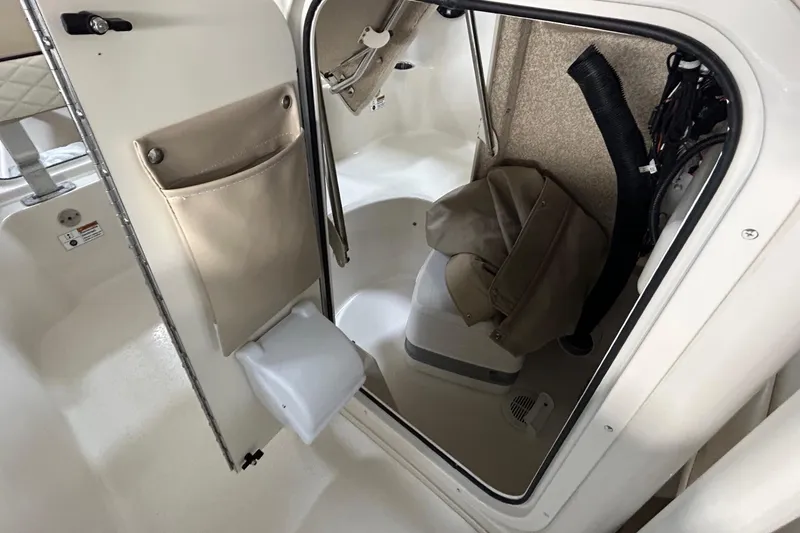 Slide: The Image of 2020 Sea Chaser 22 HFC boat interior with storage compartment and seating. - 14