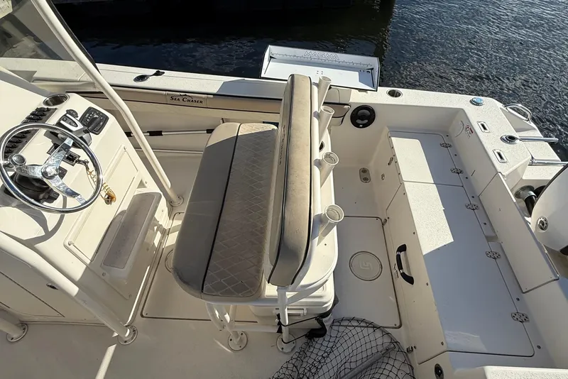 Slide: The Image of 2020 Sea Chaser 22 HFC boat interior with steering wheel and seating. - 3