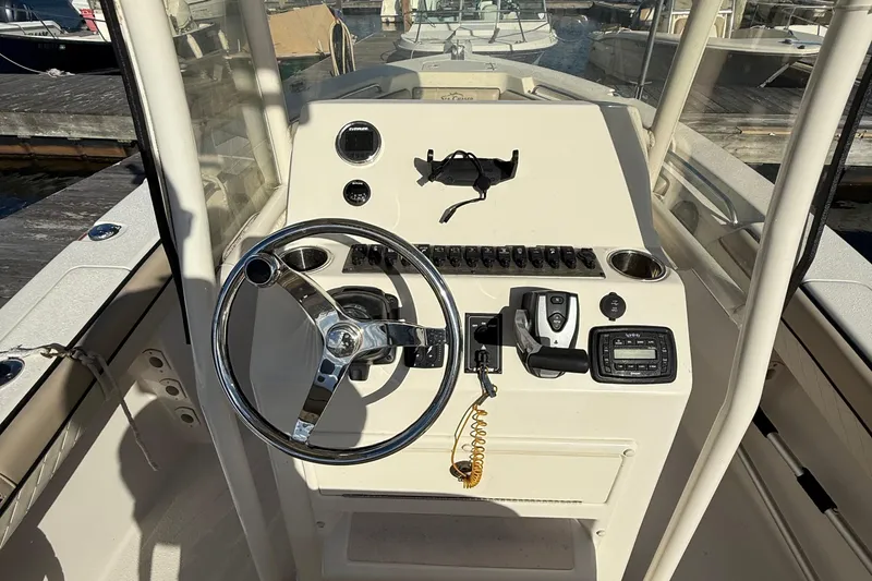 Slide: The Image of 2020 Sea Chaser 22 HFC boat console with steering wheel and controls. - 4