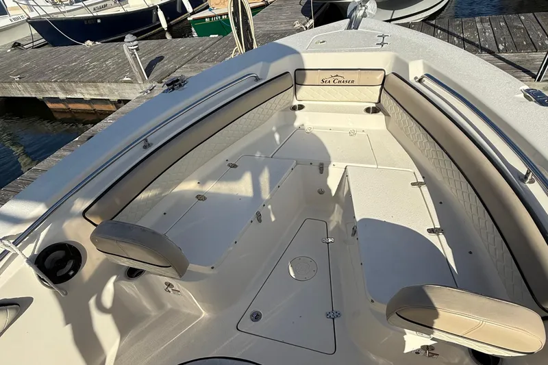 Slide: The Image of 2020 Sea Chaser 22 HFC boat interior with seating and storage at dock. - 5