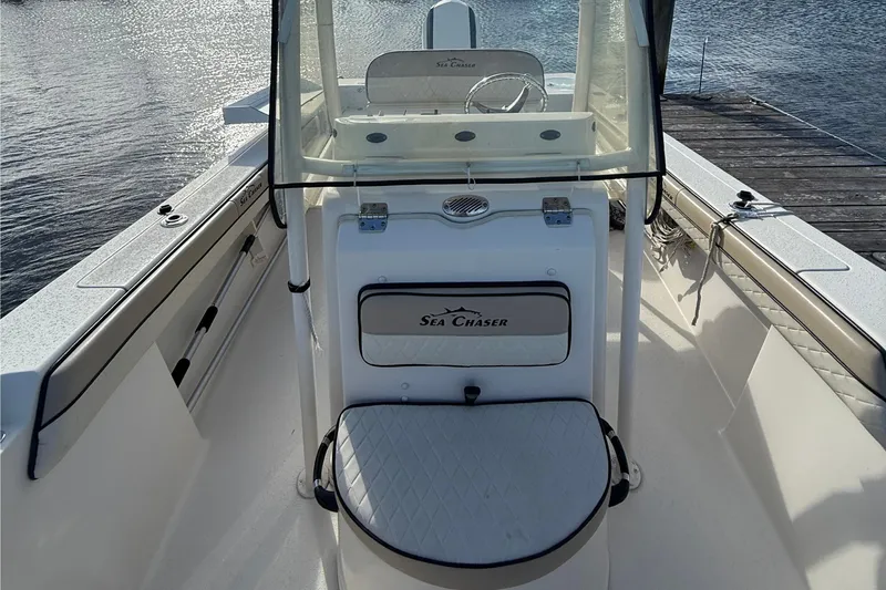 Slide: The Image of 2020 Sea Chaser 22 HFC boat interior with seating and steering console. - 6