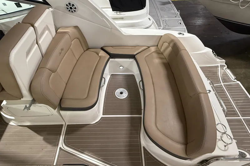Slide: The Image of 2017 Sea Ray Sundancer 330 interior seating with beige upholstery and sleek design. - 21