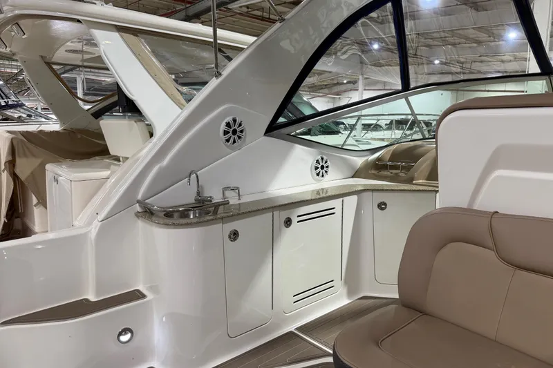 Slide: The Image of 2017 Sea Ray Sundancer 330 interior with sleek cabinetry and wood flooring. - 26