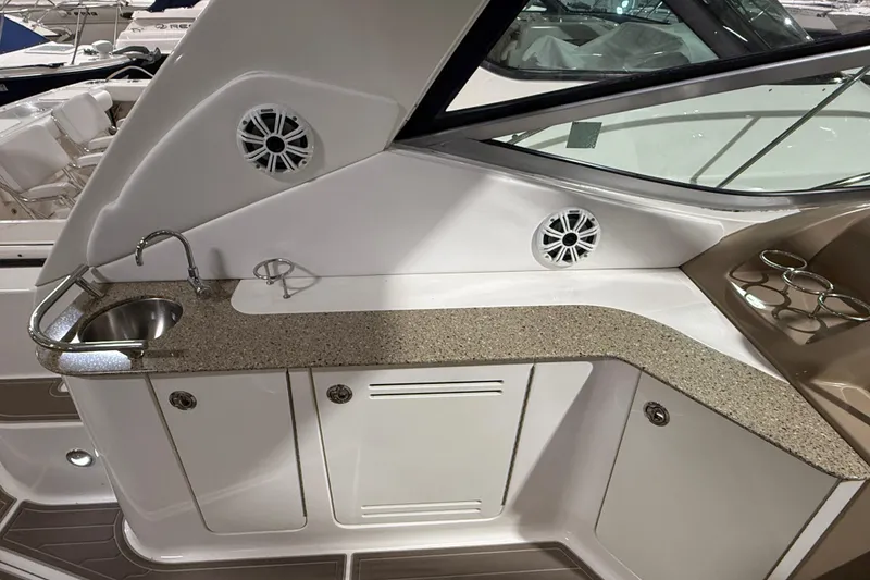 Slide: The Image of 2017 Sea Ray Sundancer 330 cockpit with modern navigation system and luxurious seating. - 28