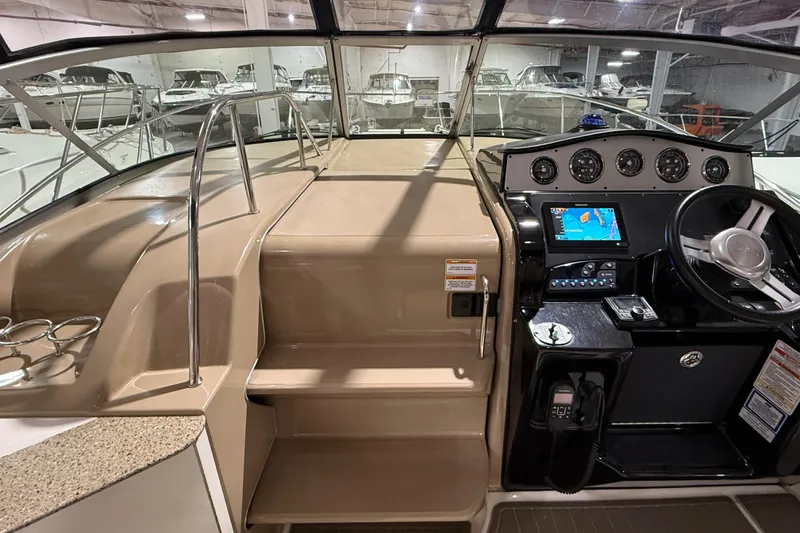 Slide: The Image of Dashboard of a 2017 Sea Ray Sundancer 330 with multiple gauges and a compass. - 33