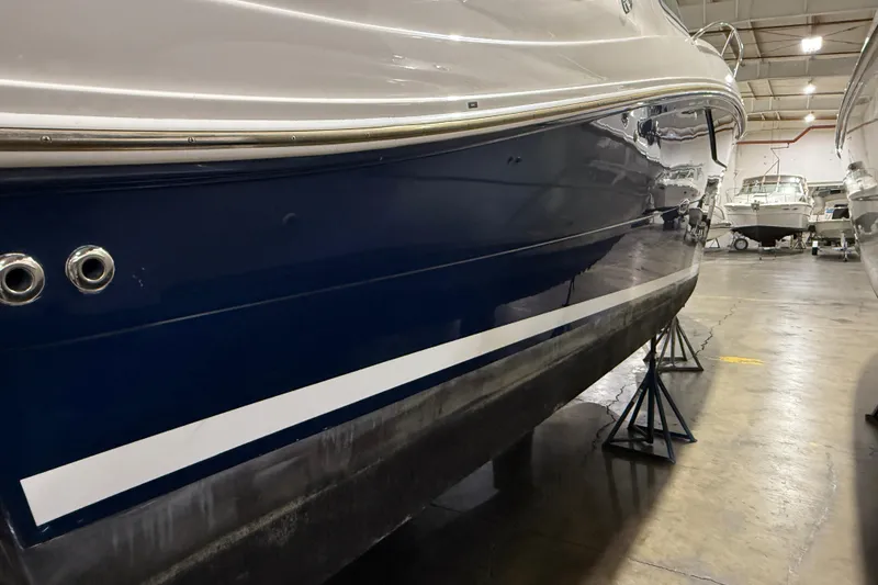 Slide: The Image of 2017 Sea Ray Sundancer 330 yacht in indoor storage, elevated on stands. - 4