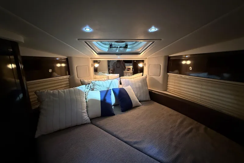 Slide: The Image of 2017 Sea Ray Sundancer 330 interior kitchen with microwave, sink, and stove. - 49