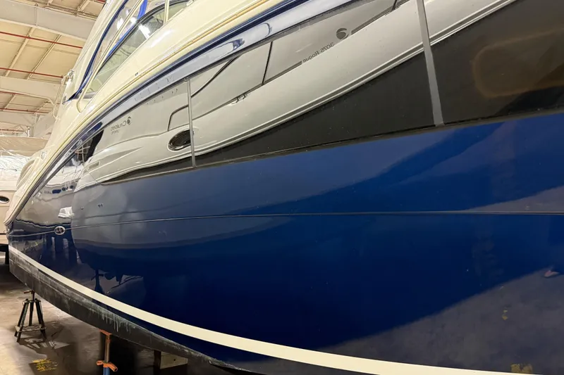 Slide: The Image of 2017 Sea Ray Sundancer 330 yacht in indoor storage, flanked by other boats. - 5