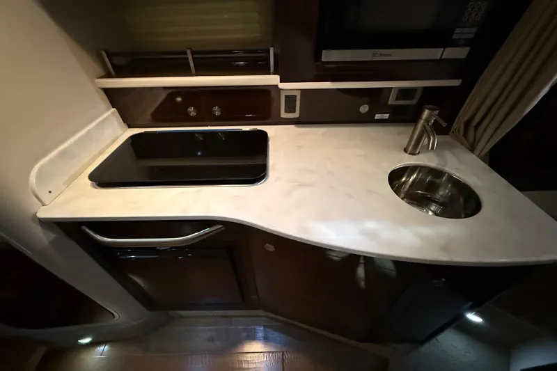 Slide: The Image of Interior of 2017 Sea Ray Sundancer 330 yacht with cozy seating and wooden steps. - 56