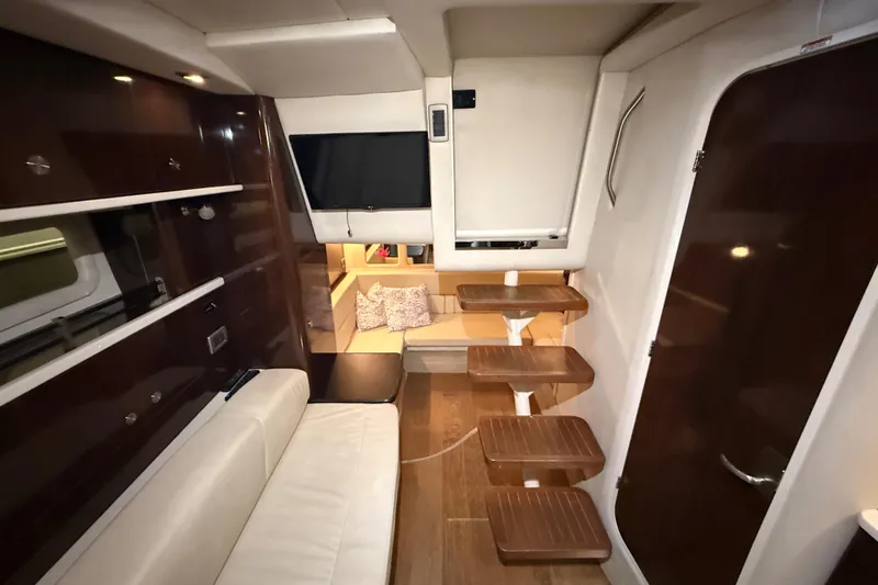 Slide: The Image of Luxurious interior of 2017 Sea Ray Sundancer 330 yacht with plush seating and decorative pillows. - 62