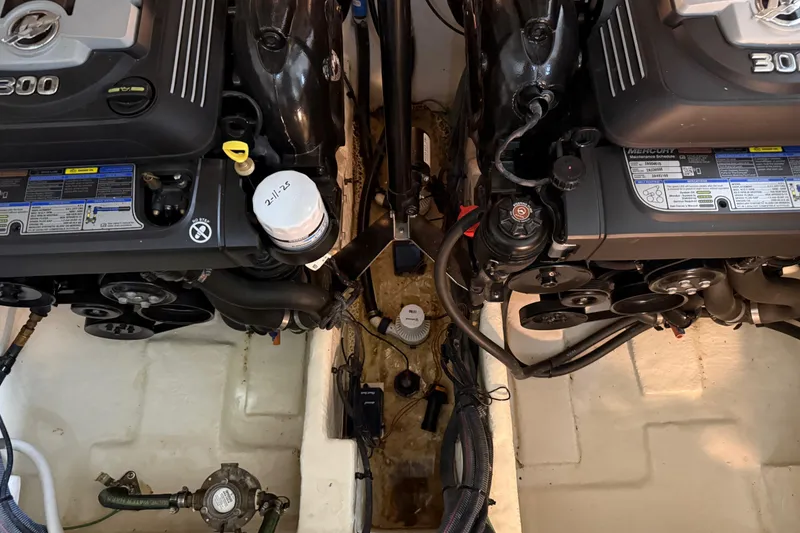Slide: The Image of Engine compartment of 2017 Sea Ray Sundancer 330 with visible components and wiring. - 75