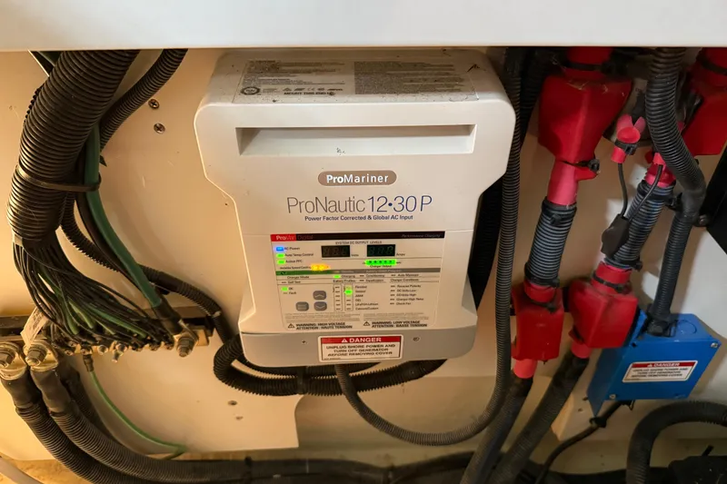 Slide: The Image of 2017 Sea Ray Sundancer 330 boat propeller and drive system in a workshop setting. - 77