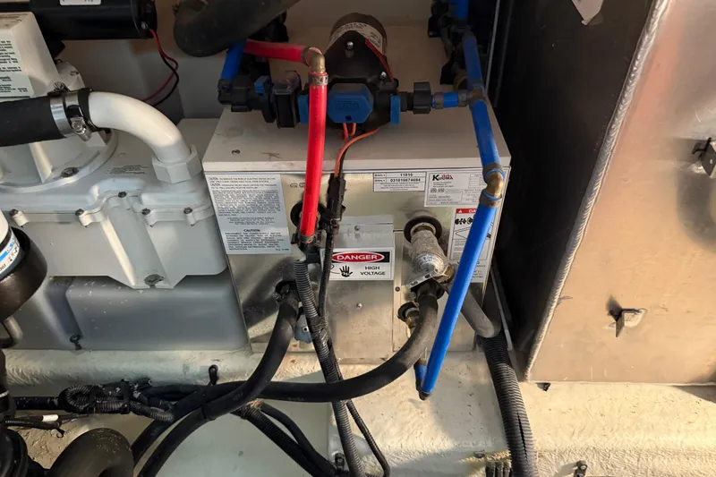 Slide: The Image of Close-up of a 2017 Sea Ray Sundancer 330 boat propeller and drive system in a workshop. - 78