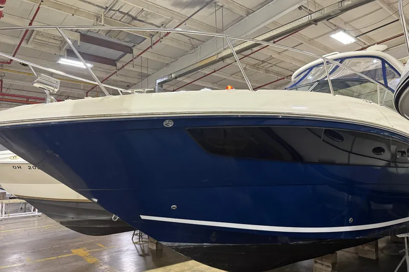 Slide: The Image of 2017 Sea Ray Sundancer 330 boats in indoor storage facility. - 8